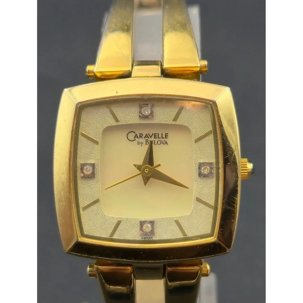Caravelle by Bulova Gold Tone Mother of Pearl Diamond Dial Watch C923015